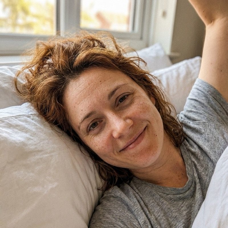 Rachel waking up rested and content in bed
